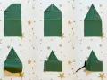 Passaggi per creare alberelli di Natale con tovaglioli piegati. Un modo creativo per decorare la tavola delle feste.