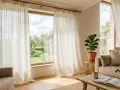 Tende leggere in lino che filtrano la luce, ideali per creare un'atmosfera rilassante. Scopri i migliori tessuti per tende.