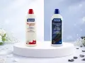 Due flaconi di detersivo Nuncas, uno bianco e uno nero, per eliminare le macchie di sapone sui vestiti e ravvivare i colori.