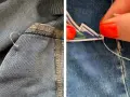 Dettaglio di come rattoppare i jeans con ago e filo, mostrando la cucitura interna e un patch decorativo applicato.