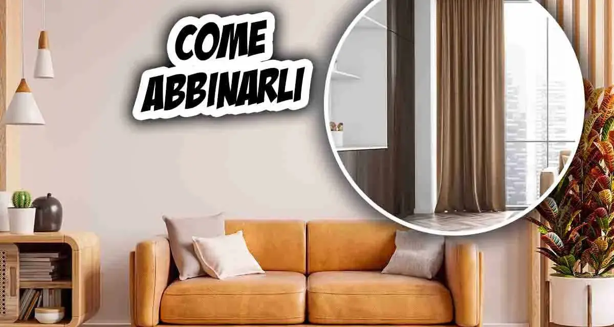 Come abbinare tende al divano: un soggiorno accogliente con divano color cuoio e tende marroni.