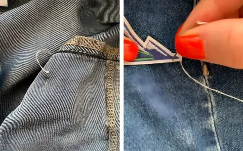 Dettaglio di come rattoppare i jeans con ago e filo, mostrando la cucitura interna e un patch decorativo applicato.