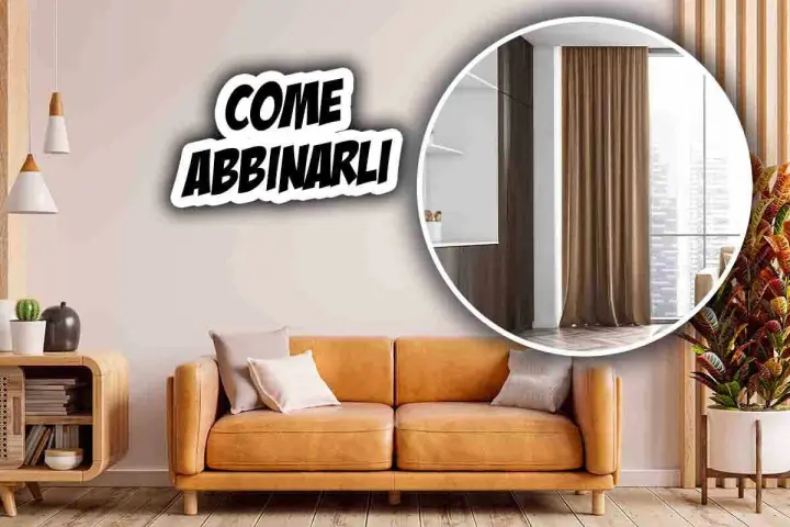 Come abbinare tende al divano: un soggiorno accogliente con divano color cuoio e tende marroni.
