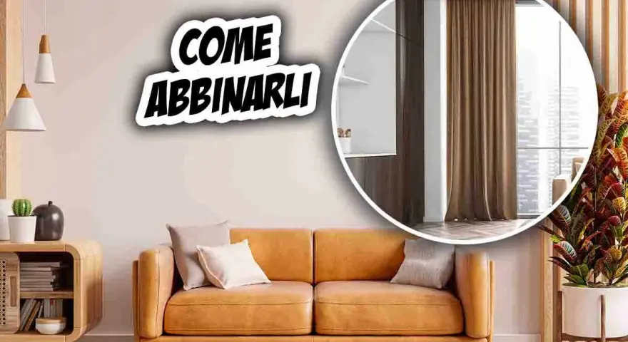 Come abbinare tende al divano: un soggiorno accogliente con divano color cuoio e tende marroni.